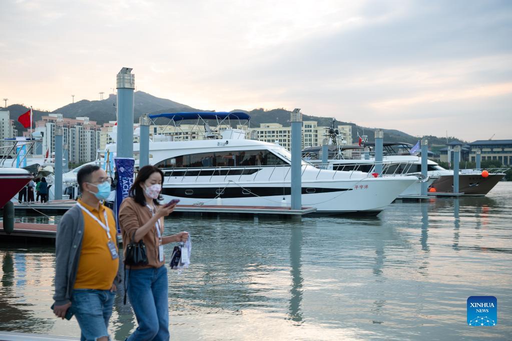 People visit the 11th China (Macao) International Yacht Import and Export Fair held in Macao, south China, Nov. 11, 2021. The yacht fair kicked off here on Thursday. (Xinhua/Cheong Kam Ka)