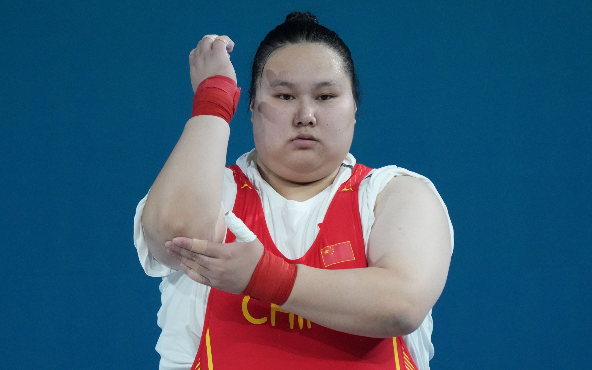 走出傷病的困擾後,李雯雯在女子舉重大級別上依然擁有統治力。圖/新華社