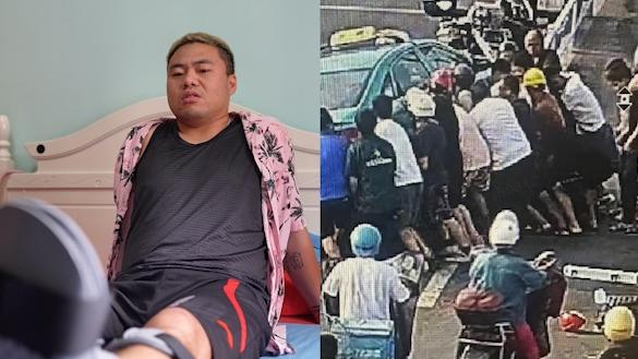 快递小哥抬车救人被压骨折