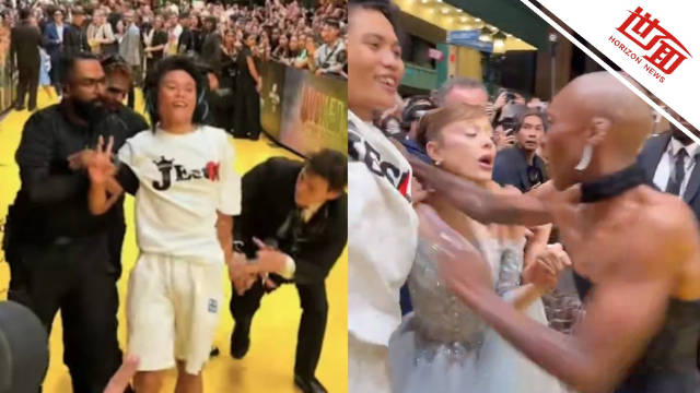 美国女演员走红毯遭一男子强行搂抱：杨紫琼将其护怀中 男子得意比手势引众怒