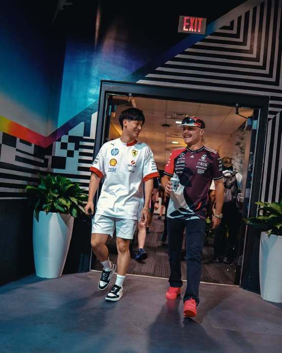 除了互动，周冠宇和博塔斯在赛场外有哪些商业合作或联动？