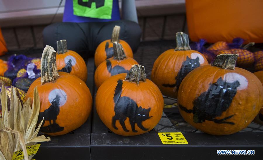 People shop for decorations for Halloween in Ontario, Canada