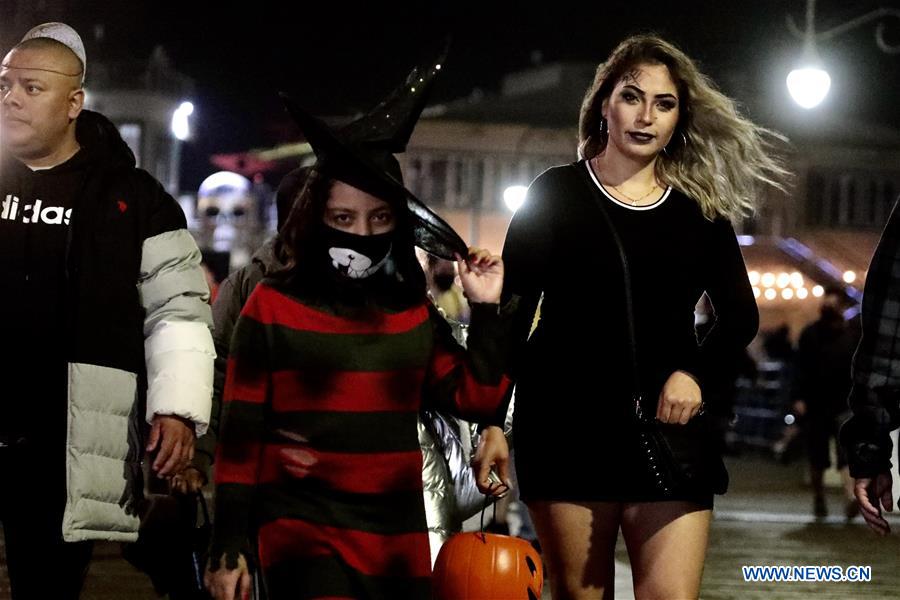 People wearing costumes celebrate Halloween in Los Angeles World News