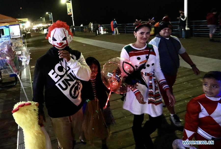 People wearing costumes celebrate Halloween in Los Angeles World News