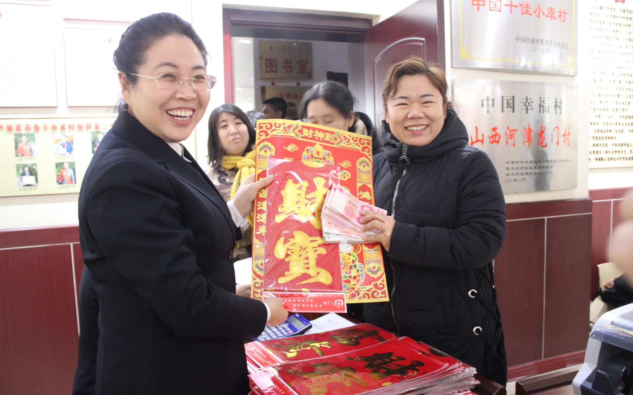 村里的分红一发就是24年。原建发 摄