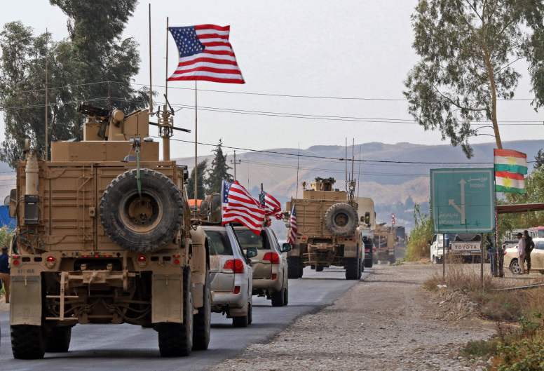 此前从叙利亚北部撤至伊拉克库尔德地区的美军车队 图片来源：法新社