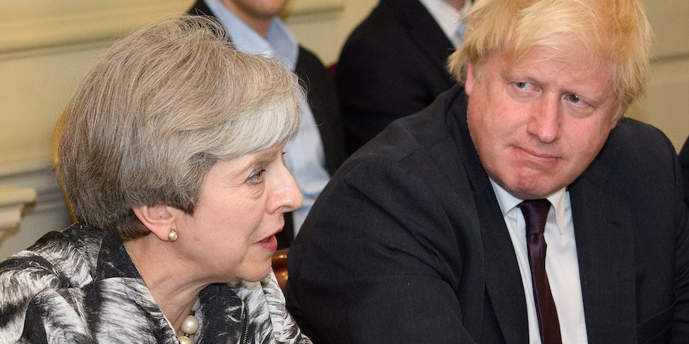 Johnson and Teresa May in the same frame photo (Reuters)
