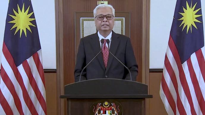 马来西亚总理向新加坡总理求情