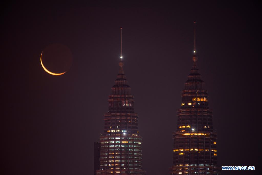 Crescent moon seen in sky above Kuala Lumpur, Malaysia World News