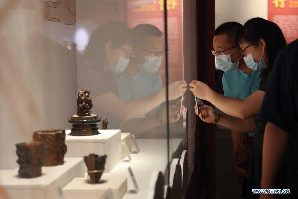 Visitors view exhibits at a Palace Museum Collection exhibition in China (Hainan) Museum of the South China Sea in Qionghai City, south China's Hainan Province, April 13, 2021. (Xinhua/Zhang Liyun)