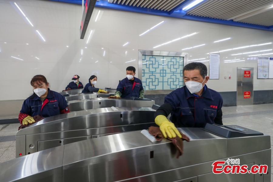 <p>Cleaning staff disinfect entrance gates at a subway station in Beijing, May 12, 2022.  (Photo: China News Service/Jia Tianyong)</p>
