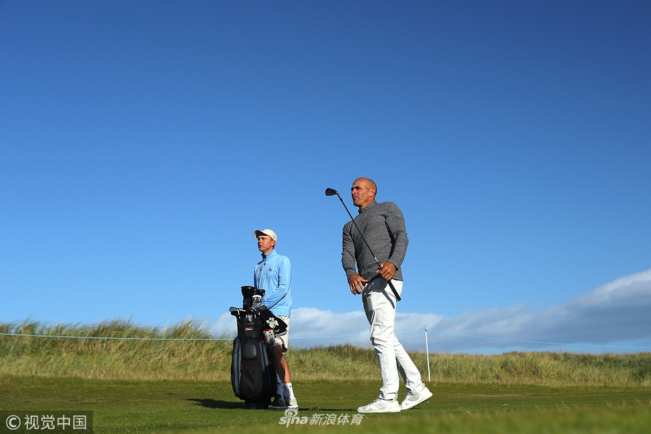 卢克-唐纳德与沙克-博格并肩而立,笑容灿烂,不同运动服色彩的交汇象征着体育世界的多元与包容。