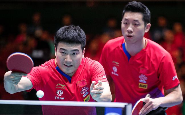 梁靖崑(左)搭档许昕(右)出战双打。图/Osports