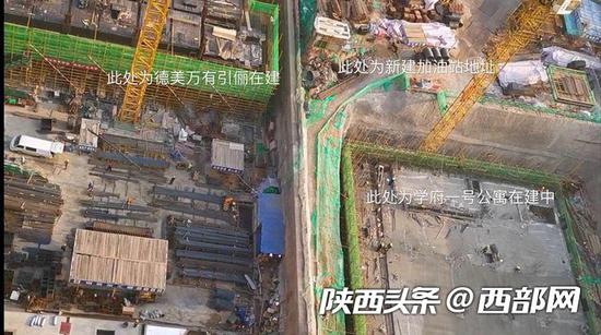 新建加油站一墙之隔是正开工的高层住宅。