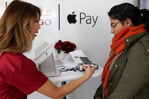 ��ƻ���㶨�����Ĵ����У�Apple Pay���뻪