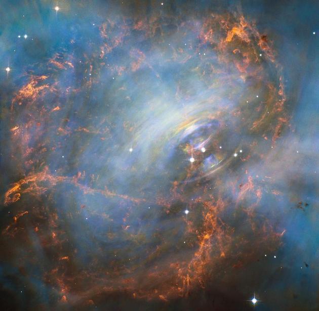 图中是位于蟹状星云中的一颗脉冲星,最新一项研究大胆猜测称,外星人可能对脉冲星进行操控,将其释放的电磁脉冲进行信息编码,作为“导航灯塔”。