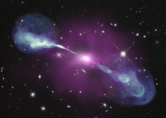 图中是X射线下武仙座A星系中心的一个巨大紫色星云,该星云被星系中心黑洞摄入物质加热达到数百万摄氏度。据悉,该星系中的超大质量黑洞质量是银河系中心黑洞的1000倍