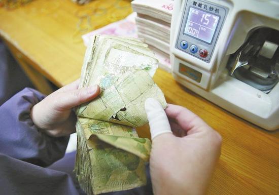 洛阳一企业用残损纸币发电 一年百万度