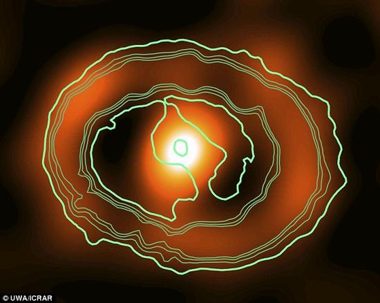 科学家对临近矮星系中的一颗死亡恒星留下的残骸进行了观测分析。此处图像所示为这一超新星遗迹的内侧碎屑轮廓，由哈勃空间望远镜拍摄(绿色/蓝色)，图像上方叠加由ALMA望远镜阵列在345 GHz波段获取的图像(红色/橘色)。