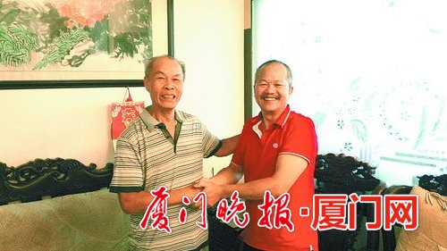 ■周育辉(右)和林金裕26年后再相见。
