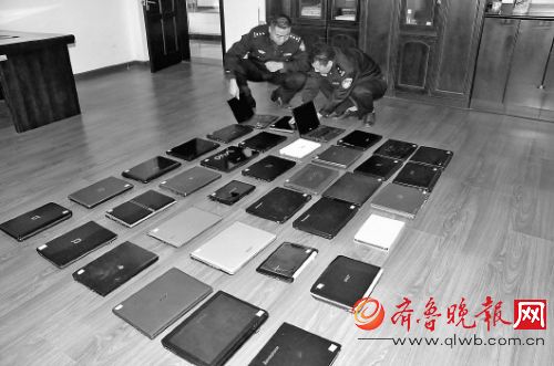 ▲青島開發區警方追回部分失竊筆記本。