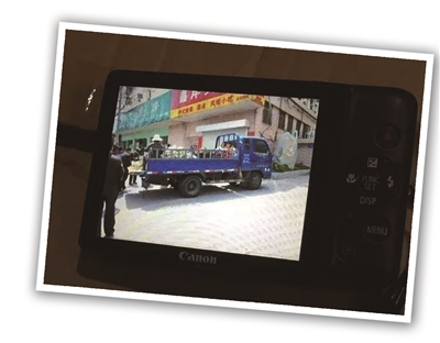 任克明生前使用的相机，照片中车辆疑为葛小燕的卡车。 资料图