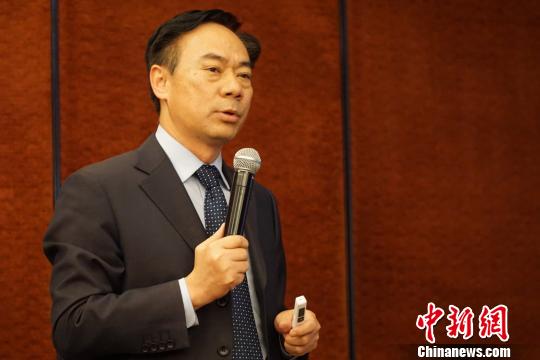 3月28日,联合国世界粮食计划署(WFP)在北京与中国农业部和其他合作伙伴发布五年战略合作计划。图为WFP驻华代表屈四喜先生在发布会上介绍中国国别战略计划。 刘旭 摄