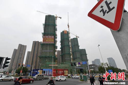 資料圖:福州一處商品房在建中。 中新社記者 呂明 攝