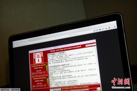 勒索病毒WannaCry利用Windows操作系统445端口存在的漏洞进行传播。图为2017年5月13日，一台位于北京的笔记本电脑屏幕上显示的勒索病毒界面。
