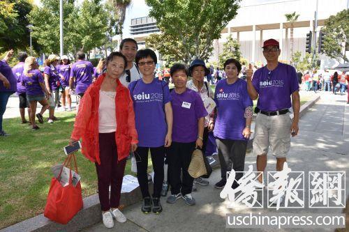 华人家庭护理工参加劳动节游行,希望涨工资。(图:美国《侨报》/记者翁羽 摄)