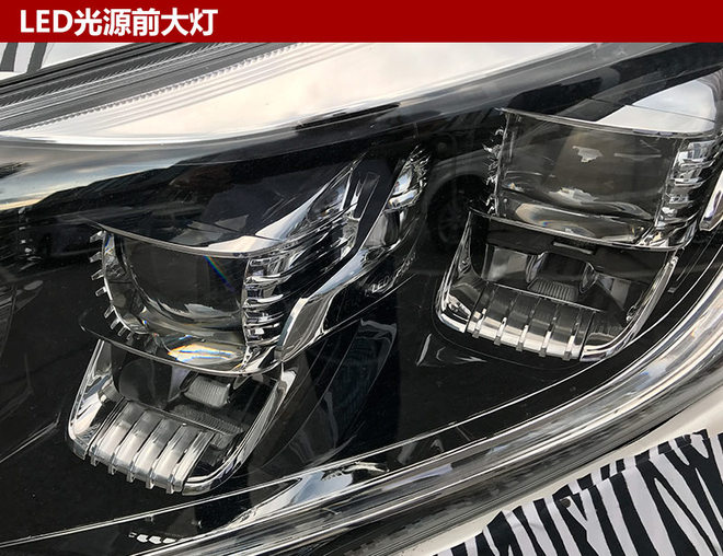 广汽传祺gm8前脸采用了多横幅式进气格,搭配两侧四灯头led大灯,整体