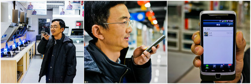 资料图片:山东某企业工程师张军在使用微信同儿子语音聊天(2013年11月30日摄)。新华社记者 王婧嫱 摄