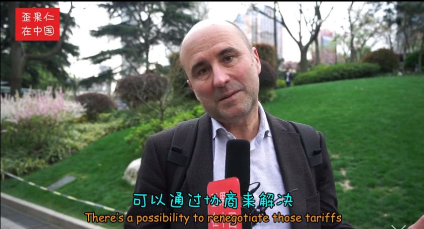 街采外国人:中美贸易战谁会赢?