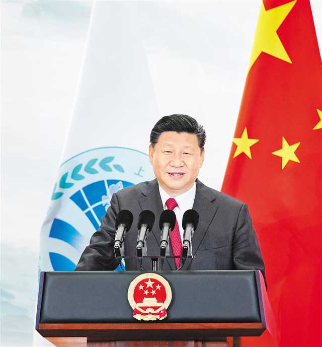 习近平欢迎出席上海合作组织青岛峰会的外方领