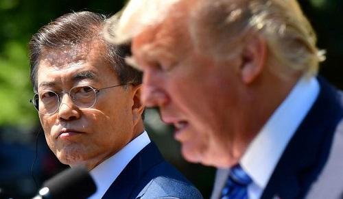 美韩首脑商定:平昌冬奥会期间推迟美韩军演|文