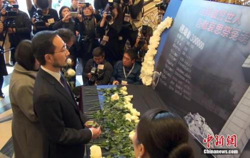 当地时间12月9日,加拿大安大略省各界华人共同举办的“南京大屠杀80周年追思会”在多伦多举行。 中新社记者 余瑞冬 摄