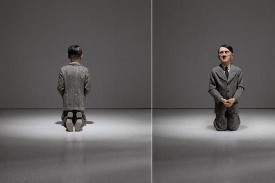 从后面看，雕像看起来像是一个孩童下跪祈祷的背影；但从正面看，观众面对的就是纳粹领导人的肖像。图片来源：美联社