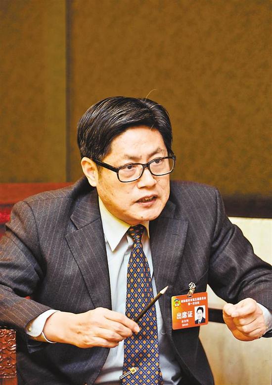 市政协委员,市交委副主任滕英明