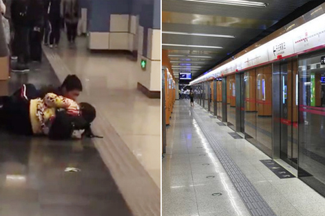 辣眼！实拍一男女学生躺地铁门外大玩亲亲