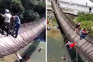 视频曝光：秭归吊桥倾翻 多名游客坠河
