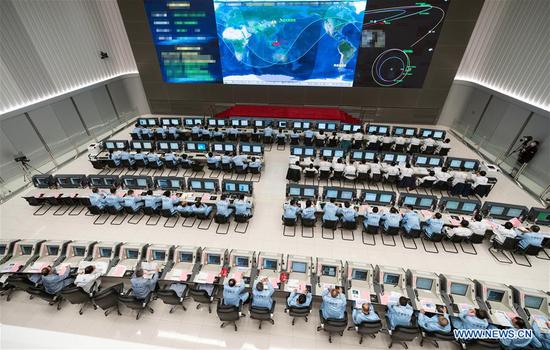 Technical personnel work at the Beijing Aerospace Control Center (BACC) in Beijing, capital of China, Oct. 9, 2020. China's Mars probe Tianwen-1 successfully conducted a deep-space maneuver on Friday night (Beijing time), according to the China National Space Administration. The probe completed the maneuver at 11 p.m. after its main engine worked for over 480 seconds. (Xinhua/Cai Yang)