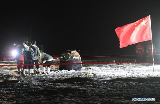 The return capsule of China's Chang'e-5 probe lands in Siziwang Banner, north China's Inner Mongolia Autonomous Region, on Dec. 17, 2020. The return capsule of China's Chang'e-5 probe touched down on Earth in the early hours of Thursday, bringing back the country's first samples collected from the moon, as well as the world's freshest lunar samples in over 40 years. (Xinhua/Lian Zhen)