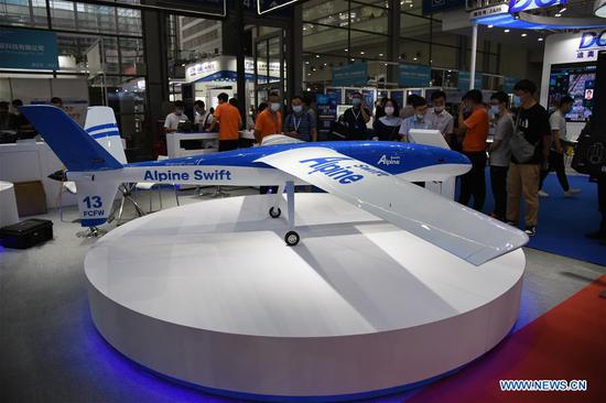 People visit the 5th Shenzhen International UAV Expo in south China's Guangdong Province, Sept. 13, 2020. The Drone World Congress 2020 and the 5th Shenzhen International UAV Expo opened here on Sunday. Over 400 enterprises will show more than 1,000 drones at the event. (Xinhua/Wang Feng)