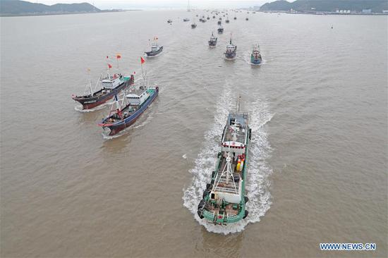 Fishing boats depart from the Shenjiamen Port in Zhoushan, east China's Zhejiang Province, Sept. 16, 2020. Fishing boats departed from ports in Zhejiang Province at noon on Wednesday, marking the end of the four-and-a-half month summer fishing ban in the East China Sea. (Photo by Chen Yongjian/Xinhua)