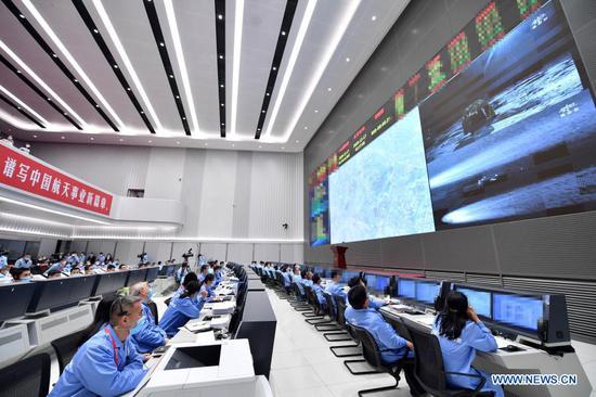 Technical personnel monitor the landing of the return capsule of China's Chang'e-5 probe at Beijing Aerospace Control Center in Beijing, capital of China, Dec. 17, 2020. The return capsule of China's Chang'e-5 probe touched down on Earth in the early hours of Thursday, bringing back the country's first samples collected from the moon, as well as the world's freshest lunar samples in over 40 years. (Xinhua/Yue Yuewei)