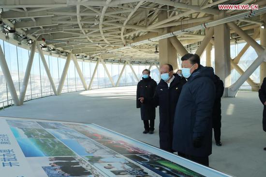 Chinese President Xi Jinping, also general secretary of the Communist Party of China Central Committee and chairman of the Central Military Commission, inspects the National Ski Jumping Center in Zhangjiakou, north China's Hebei Province, Jan. 19, 2021. Xi on Tuesday arrived in Zhangjiakou by taking the Beijing-Zhangjiakou high-speed rail. He inspected the Taizicheng rail station close to the competition venues and athletes' village of the Beijing 2022 Olympic and Paralympic Winter Games, the National Ski Jumping Center, and the National Biathlon Center. (Xinhua/Ju Peng)