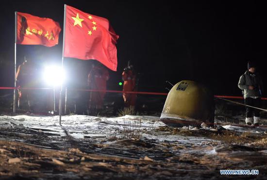 The return capsule of China's Chang'e-5 probe lands in Siziwang Banner, north China's Inner Mongolia Autonomous Region, on Dec. 17, 2020. The return capsule of China's Chang'e-5 probe touched down on Earth in the early hours of Thursday, bringing back the country's first samples collected from the moon, as well as the world's freshest lunar samples in over 40 years. (Xinhua/Ren Junchuan)