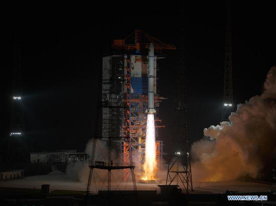 A Long March-2C carrier rocket blasts off from the Xichang Satellite Launch Center in southwest China's Sichuan Province on Oct. 26, 2020. China successfully sent a group of new remote-sensing satellites into orbit from the Xichang Satellite Launch Center in southwest China's Sichuan Province on Monday. Belonging to the Yaogan-30 family, the satellites were launched by a Long March-2C carrier rocket at 11:19 p.m. (Beijing Time). (Photo by Guo Wenbin/Xinhua)