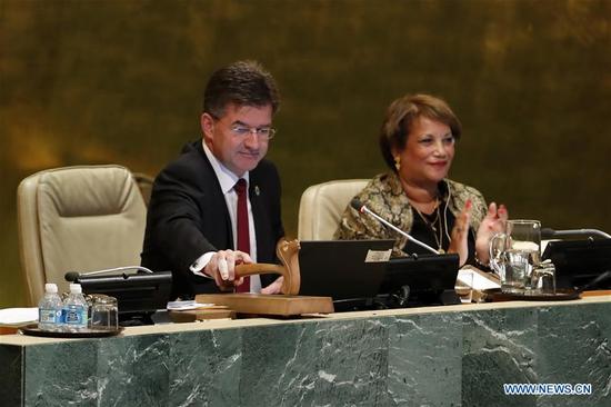 Miroslav Lajcak (L), President of the 72nd United Nations General Assembly, gavels to close the General Debate of the 72nd United Nations General Assembly at the UN headquarters in New York, Sept. 25, 2017. The VIP session of the United Nations General Assembly (UNGA) for 2017 concluded here on Monday, after all 196 representatives spoke at the marble podium in the past week. (Xinhua/Li Muzi)