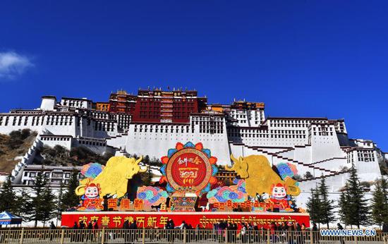 Decorations for the Spring Festival and the Tibetan New Year are seen in front of the Potala Palace in Lhasa, capital of southwest China's Tibet Autonomous Region, Feb. 8, 2021. Both the Spring Festival and the Tibetan New Year falls on Feb. 12 this year. (Xinhua/Chogo)